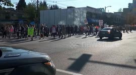 Vaccination opponents march at intersection of West Broadway Avenue with Spruce Street in Vancouver, BC, Canada