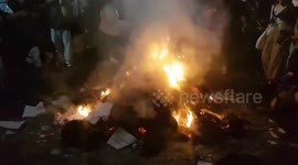 Protesters dancing around a bonfire right in the center of Bangkok, Thailand