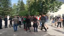 Protesters chant slogans in the face of the police  in Cetinje, Montenegro