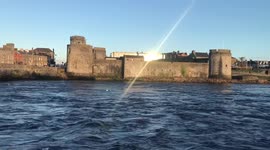 Sun reflection off King John’s castle in Limerick city, Ireland