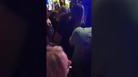 Singer Olly Murs stops mid-show to help woman who collapsed then halts again to thank loyal fan with Down Syndrome