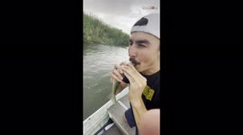 Bizarre moment US man saves dying fish by performing CPR