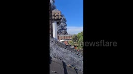 Huge plumes of black smoke fill the sky over Kidderminster, UK