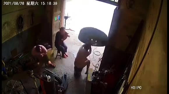 Tyre explodes while being inflated, knocking over man on chair in China ...