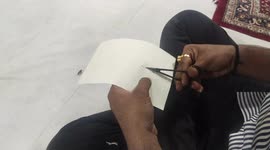 The parrot is made by cutting it with scissors on handmade paper which is beautiful.