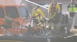 Dungeness RNLI arrives at Dover after picking up migrants in the English Channel on Wednesday