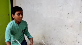 A funny boy showed spinning top different angles