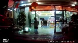 Vehicles drive through hotel to enter car park in China