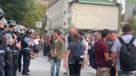 The  young demonstrator looks into the faces of the police, Ljubljana, Slovenia
