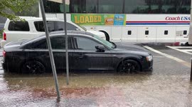 Watch as torrential rain floods the streets of Washington DC