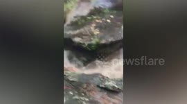 Three youngsters stuck under waterfall rescued in Thailand