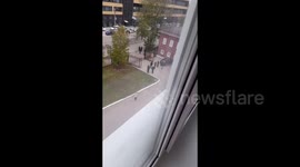 The girl films the police from the window of the Perm University, Perm, Russia