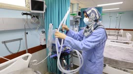 Palestinian medical workers inspect the COVID-19 intensive care unit at European Gaza Hospital