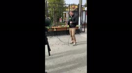 The journalist is reporting at the entrance to the Perm University in Perm, Russia