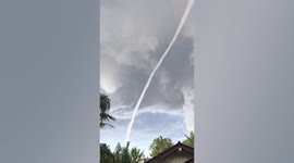Long waterspout seen from family’s backyard in Thailand