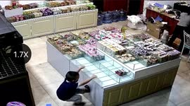 Glass storage boxes land on 5-year-old after he hangs off them at shop in China