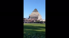 Protesters gather outside the Temple of Remembrance War Memorial in Melbourne, Australia