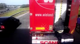 Migrants in Calais attempt to climb into UK-bound trucks