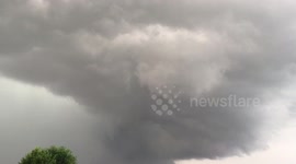 Tornado forming over golf course