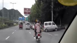 Motorcyclist's dangerous embrace