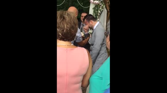 Groom overcome with emotion at the altar