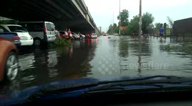 Car drives through deep floodwater in Hungary