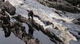 The fisherman across the river in Sneem -Irland