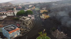 Drone footage - La Palma Volcano 22/09/2021. Static video from the drone looking at the magma devouring the town