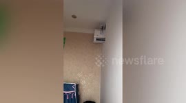 Chinese mum installs air-con unit in between rooms to save energy