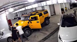 Chinese mechanic crushed after car he was working on suddenly rolls forward