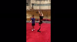 Aerial artist lifted a 65 kilogram man with his teeth, Moscow, Russia