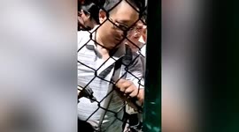 Elderly Chinese residents force their way onto football pitch for dance class