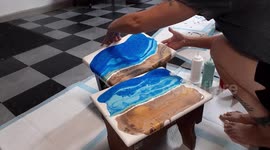 Artist pours paint over furniture to create DIY marble-like pattern