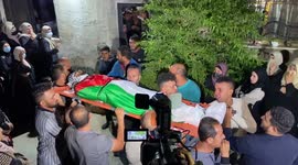 Mourners attend the funeral of Mohammed Khabisa, a Palestinian who was shot dead by Israeli troops