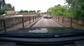 Dashcam footage captures moment Toyota crashes going too fast around a corner in Stockport