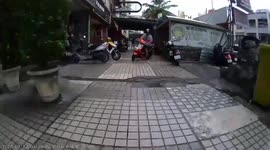 ACCIDENT / FAIL: Moped Driver Spins Out On A Slippery Sidewalk And Crashes (Dashcam Video)