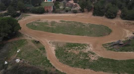 Motocross circuit with overhead plane. Dirtrack circuit and house belonging to the farm