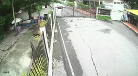 Out-of-control car crashes through university gate in Thailand