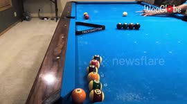 'Pool shark puts a new twist on the classic 'Through the Window' trick shot 
'