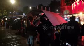 Fans Wait to Capture A Glimpse Of the James Bond No Time To Die Cast as It Pours With Rain