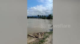 Huge garden jar washed away in floods crashes into bridge