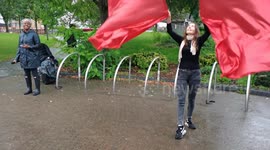 Christian preaching dancing and waving two red flag