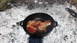 In the forest, I fry meat over a fire. In the forest, I fry meat over a fire. Very juicy pork ribs.