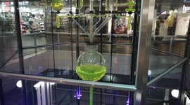 Amazing clock located in a shopping center in Berlin. The liquid flows through the tubes and shows the exact time.