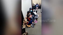 Tourists stay in public toilet overnight to keep warm as they wait to see sunrise on China's Mount Tai