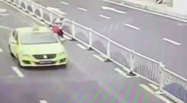 Rule-breaking pensioner tears down traffic barriers to take a shortcut in China