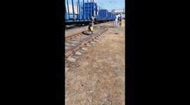 Elderly man crossing over carriage gets stuck as train departs