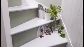 Grandmother-of-12 tiny mouse house in staircase complete with BBQ set and guitar