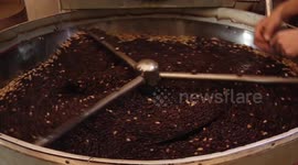 Palestinian men work at a coffee factory in Gaza city