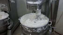 Palestinian workers prepare the vanilla candy known as 